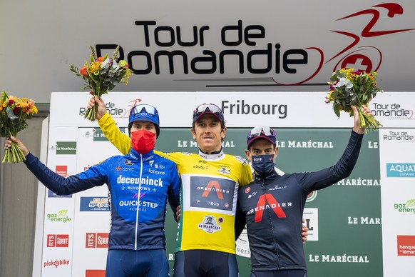 epa09173778 Britain&#039;s Geraint Thomas of team Ineos Grenadiers celebrates in his yellow jersey on the podium after winning the 74th Tour de Romandie cycling tour, Fribourg, Switzerland, 02 May 202 ...