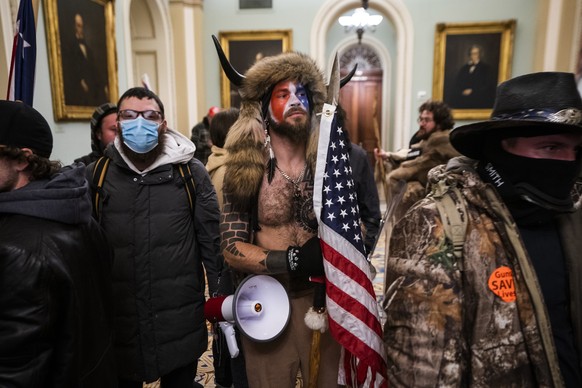 epa08923449 Supporters of US President Donald J. Trump gather outside of the Senate chamber after they breached the US Capitol security in Washington, DC, USA, 06 January 2021. Protesters stormed the  ...