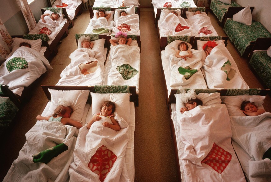Little girls curl up for their naps at the Lenin Collective Farm&#039;s day care center, where they are looked after while their parents are working. | Location: Near Stavropol, USSR. (Photo by © Wall ...