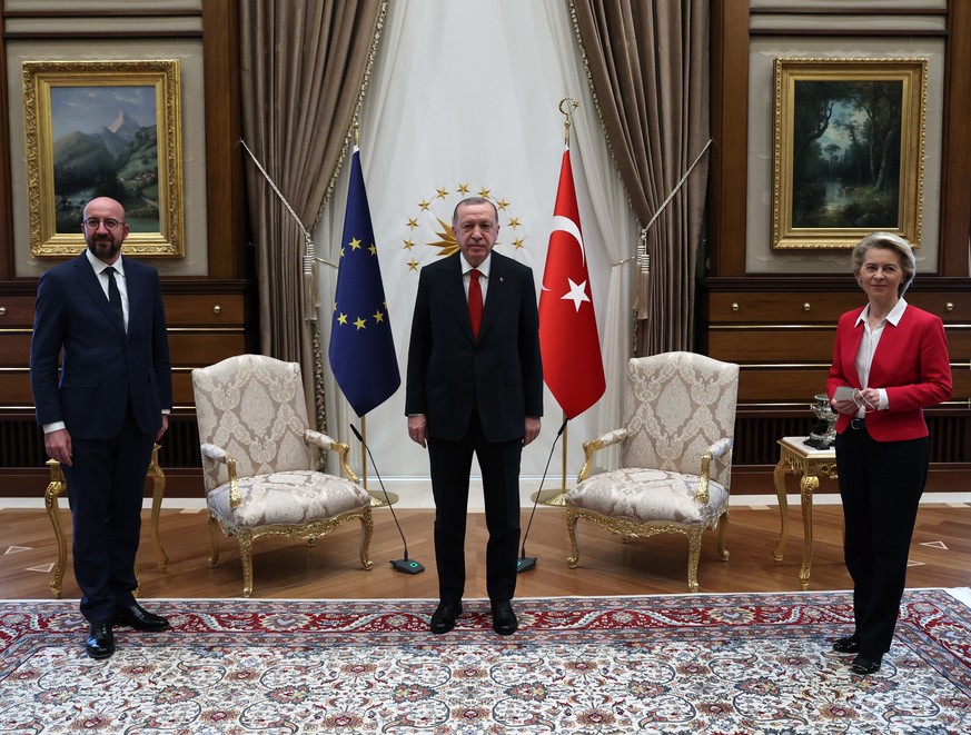 epa09118484 A handout photo made available by Turkish President Press Office shows, Turkish President Recep Tayyip Erdogan (C), EU Council President Charles Michel (L) and President of EU Commission U ...