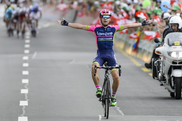Kristijan Durasek from Croatia of team Lampre-Merida, raises his armes as he crosses the finish line to win the 2nd stage, a 161,1 km race, from Rotkreuz to Rotkreuz, at the 79th Tour de Suisse UCI Pr ...