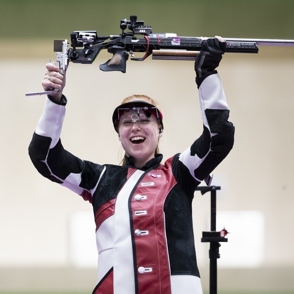 Nina Christen of Switzerland celebrates winning the gold medal in the women&#039;s shooting 50m Rifle 3 Positions Finals at the 2020 Tokyo Summer Olympics in Tokyo, Japan, on Saturday, July 31, 2021.  ...