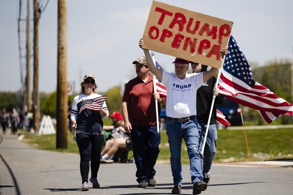 People gather ahead of President Donald Trump&#039;s schedule visit an Owens and Minor warehouse in Allentown, Pa., Thursday, May 14, 2020. (AP Photo/Matt Rourke)