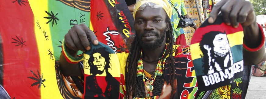 epa07197390 (FILE) - A member of the group Ivoire Binghi displays reggae clothing during the second edition of the International Festival of Abidjan Reggae know as Abi-Reggae at the Palace of Culture  ...
