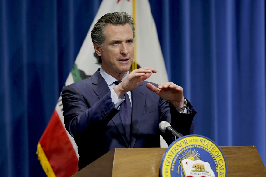 FILE - In this May 14, 2020, file photo, California Gov. Gavin Newsom discusses his revised 2020-2021 state budget during a news conference in Sacramento, Calif. Gov. Gavin Newsom announced Friday, Ju ...