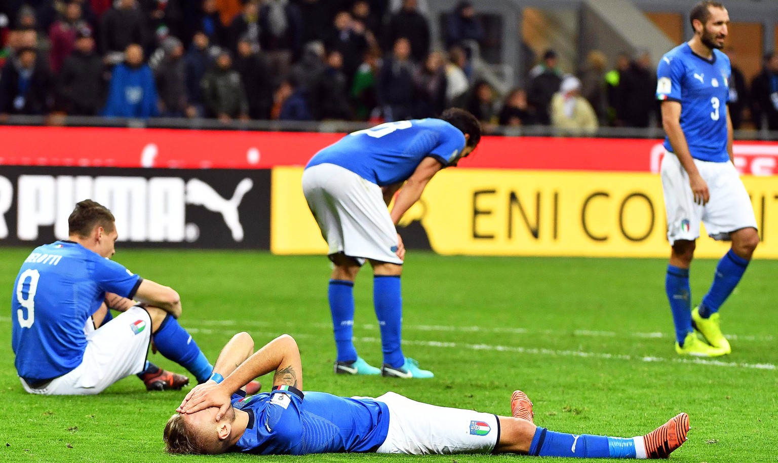 epaselect epa06327487 Players of Italy show their dejection after the FIFA World Cup 2018 qualification playoff, second leg soccer match between Italy and Sweden at the Giuseppe Meazza stadium in Mila ...