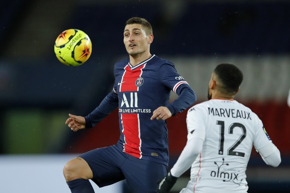 PSG&#039;s Marco Verratti, left, jumps for the ball past Lorient&#039;s Sylvain Marveaux during the French League One soccer match between Paris Saint-Germain and Lorient at the Parc des Princes in Pa ...