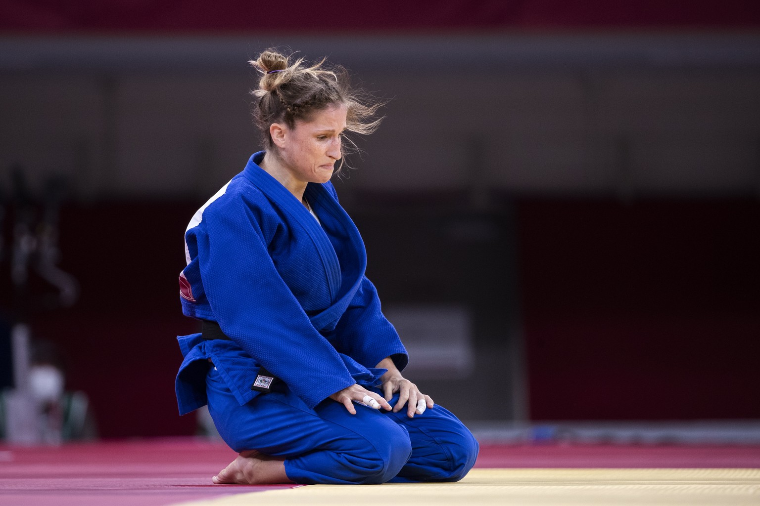 Fabienne Kocher of Switzerland is disappointed after her defeat in the bronze medal fight against Great Britain&#039;s Chelsie Giles during the women&#039;s judo -52kg competition at the 2020 Tokyo Su ...