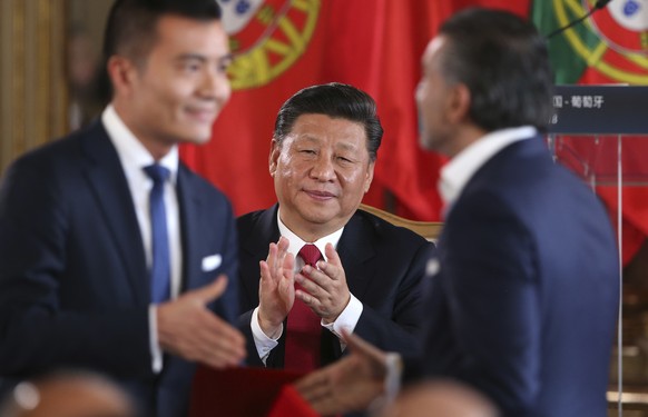 China&#039;s President Xi Jinping applauds during the signing of agreements between the Portugal and China, Wednesday, Dec. 5, 2018, at the Queluz National Palace in Queluz, outside Lisbon. Portugal i ...