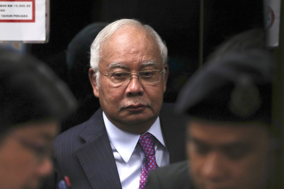 FILE - In this June 18, 2019, file photo, former Malaysian Prime Minister Najib Razak walks into the lift as he arrives at Kuala Lumpur High Court in Kuala Lumpur, Malaysia. Najib made a religious oat ...