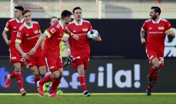 Union&#039;s Max Kruse holds the ball as he celebrates after scoring his side&#039;s first goal during the German Bundesliga soccer match between 1. FC Union Berlin and 1. FC Cologne in Berlin, German ...