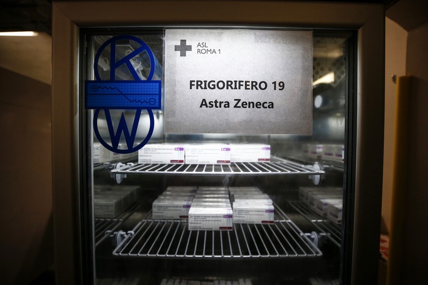 Packages containing doses of the AstraZeneca vaccine are kept in a fridge at vaccination center in Rome, Tuesday, Feb. 9, 2021. The Italian government revamped its vaccination plans last week after Pf ...