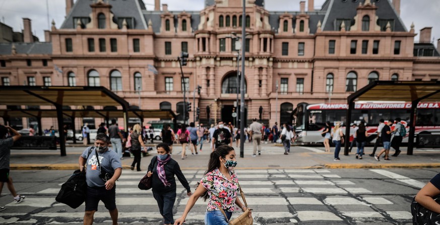 epa09049020 Pedestrians in a square near the Constitucion Railway Station, in Buenos Aires, Argentina, 03 March 2021. One year after the first coronavirus infection, Argentina continues as one of the  ...