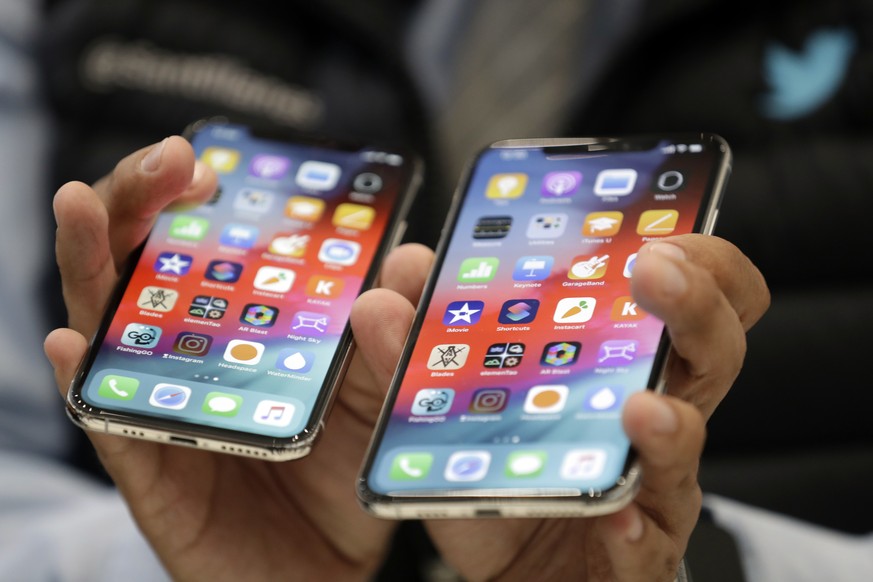 The iPhone XS, left, and XS Max are displayed side to side during an event to announce new products at Apple headquarters Wednesday, Sept. 12, 2018, in Cupertino, Calif. (AP Photo/Marcio Jose Sanchez)