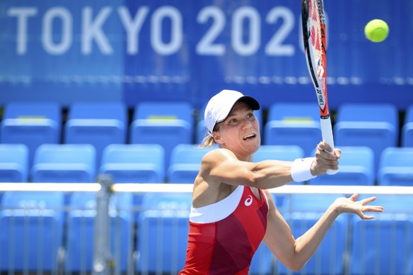 epa09360772 Viktorija Golubic of Switzerland returns a ball to Maria Camila Osorio Serrano of Colombia during the women&#039;s single tennis first round match at the 2020 Tokyo Summer Olympics at the  ...