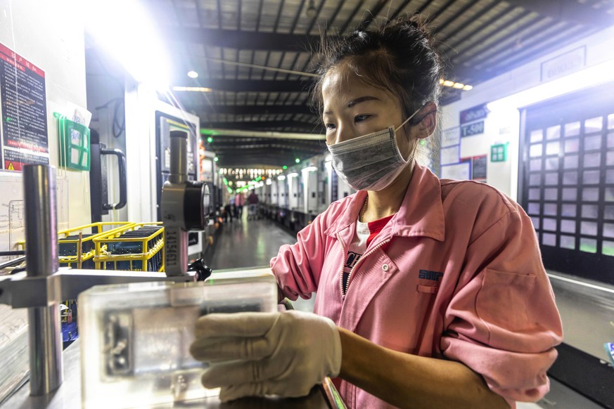 epa07558236 A woman works in Everwin precision technology factory in Dongguan, Guangdong Province, China, 09 May 2019.
Everwin is Asia&#039;s largest intelligent processing workshop, they produce cas ...