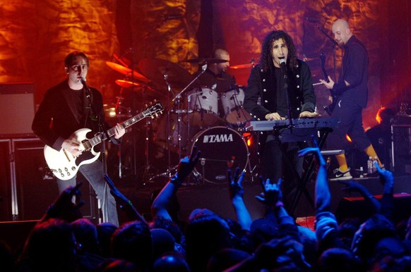 System of a Down lead singer Serj Tankian, second from right, lead guitarist Daron Malakian, left, drummer John Dolmayan, second from left, and bass player Shavo Odadjian, right, perform on MTV2&#039; ...