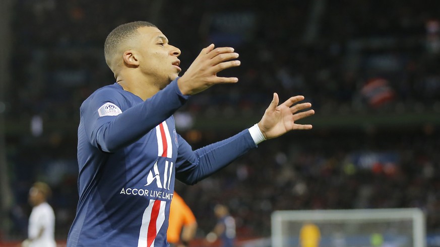PSG&#039;s Kylian Mbappe reacts after missing a scoring chance during the French League One soccer match between Paris-Saint-Germain and Dijon, at the Parc des Princes stadium in Paris, France, Saturd ...