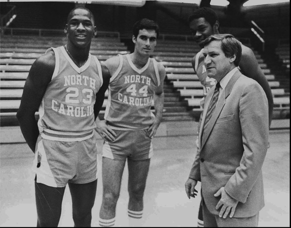 This is an October 14, 1982 photo of Michael Jordan, far left, Matt Doherty (44), Sam Perkins and coach Dean Smith, far right, of the University of North Carolina. On Thursday, October 9, 1997 Smith r ...