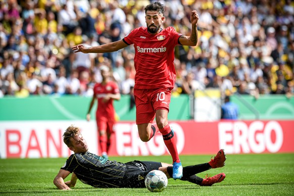 epa07766217 Aachen&#039;s Peter Hackenberg (buttom-L) in action against Leverkusen&#039;s Kerem Demirbay (top-R) during the German DFB Cup 1st round soccer match between Alemannia Aachen and Bayer Lev ...