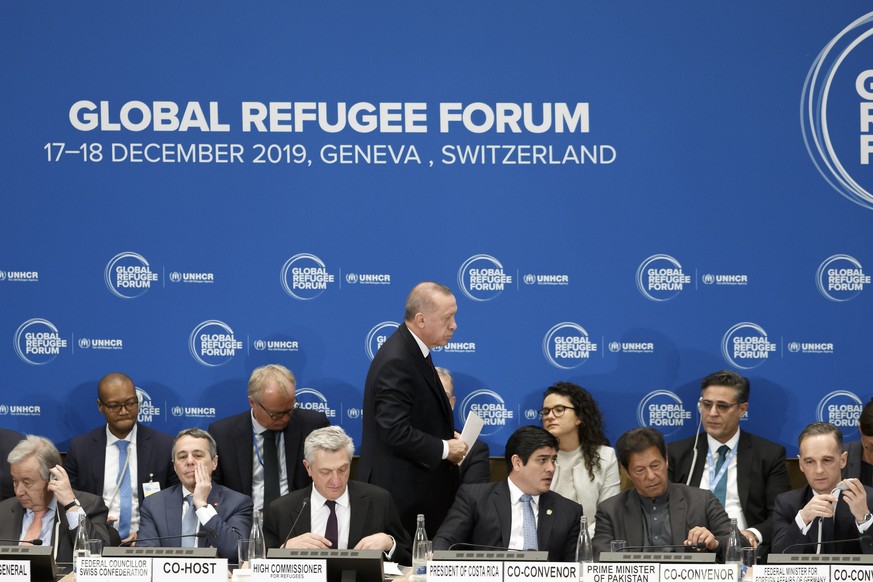 Turkey&#039;s President Recep Tayyip Erdogan, center, walks behind, from left, U.N. Secretary-General Antonio Guterres, Swiss Foreign Minister Ignazio Cassis, UN High Commissioner for Refugees Filippo ...