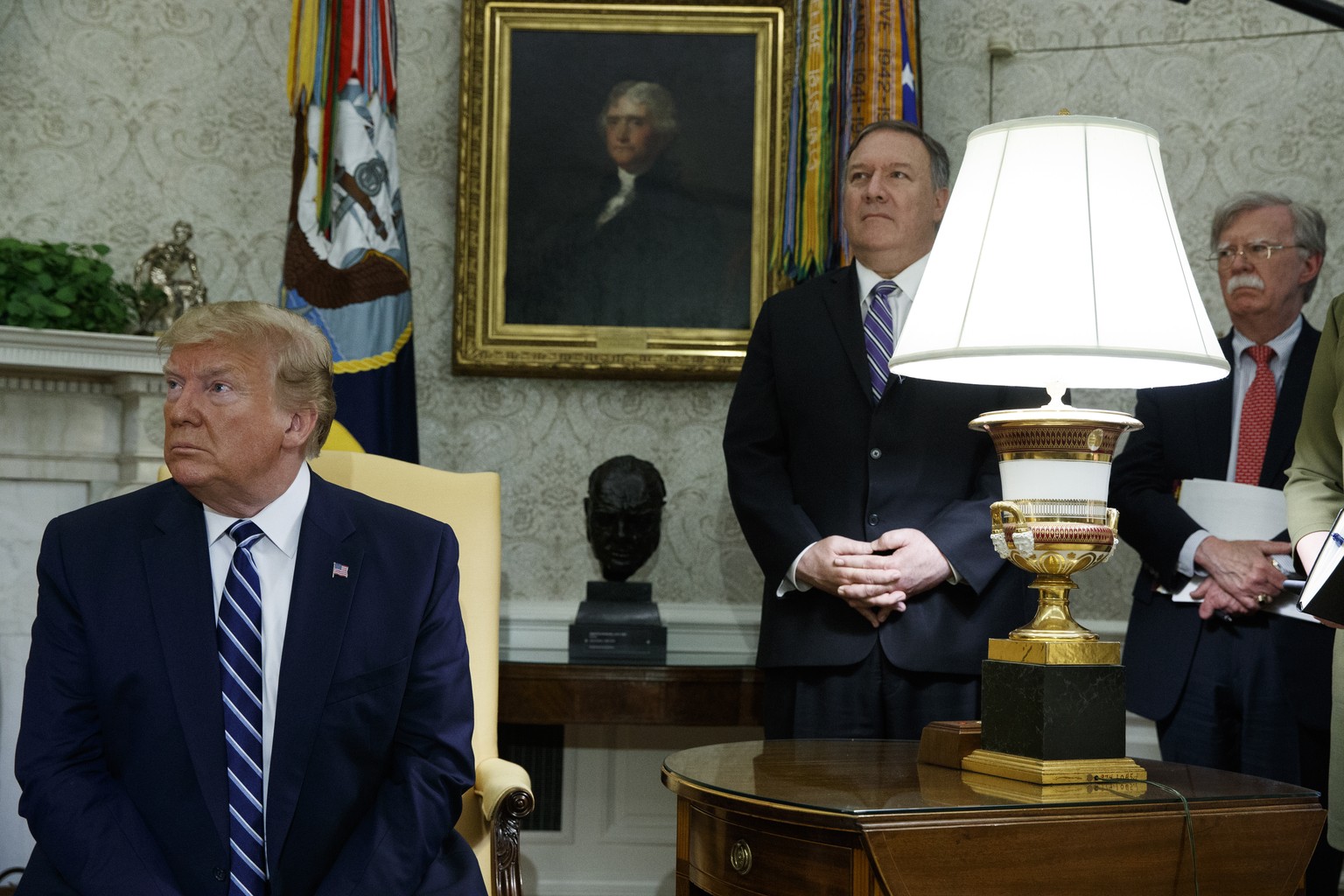 Secretary of State Mike Pompeo and National security adviser John Bolton look on as President Donald Trump meets with Canadian Prime Minister Justin Trudeau in the Oval Office of the White House, Thur ...