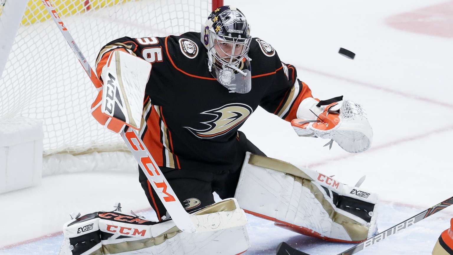 FILE - Anaheim Ducks goaltender John Gibson blocks a shot during the third period of an NHL hockey game against the Vegas Golden Knights in Anaheim, Calif., in this Sunday, Feb. 23, 2020, file photo.  ...