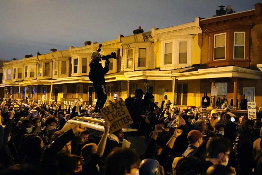 Protesters confront police during a march Tuesday Oct. 27, 2020 in Philadelphia. Hundreds of demonstrators marched in West Philadelphia over the death of Walter Wallace, a Black man who was killed by  ...