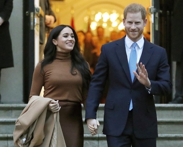 FILE - In this Jan. 7, 2020, file photo, Britain&#039;s Prince Harry and Meghan, Duchess of Sussex leave after visiting Canada House in London. Prince Harry and Meghan Markle have moved into a new fam ...