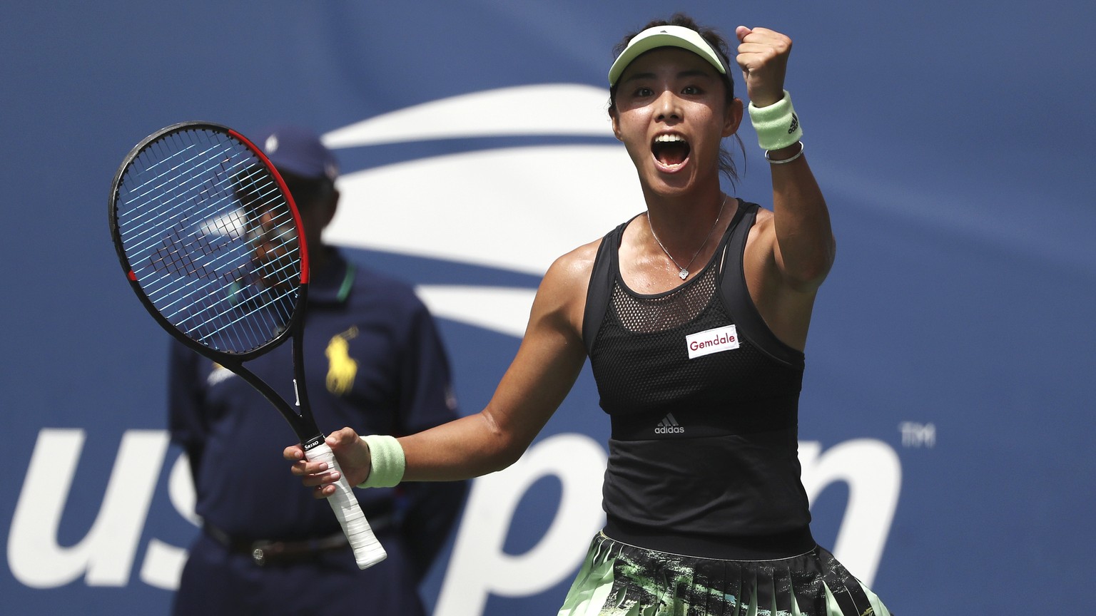 Qiang Wang, of China, reacts after defeating Ashleigh Barty, of Australia, during round four of the US Open tennis championships Sunday, Sept. 1, 2019, in New York. (AP Photo/Kevin Hagen)