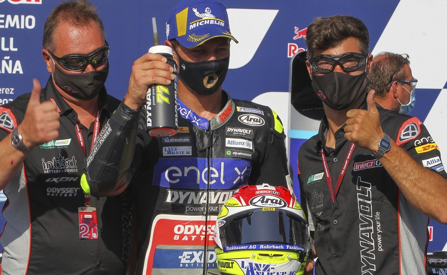 Swiss driver Dominique Aegerter, center, celebrates his third position after the MotoE race during the Spanish Motorcycle Grand Prix race at the Angel Nieto racetrack in Jerez de la Frontera, Spain, S ...