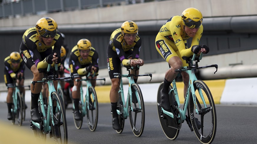 Team Jumbo Visma strains during the second stage of the Tour de France cycling race, a team time trial over 27.6 kilometers (17 miles) with start and finish in Brussels, Belgium, Sunday, July 7, 2019. ...