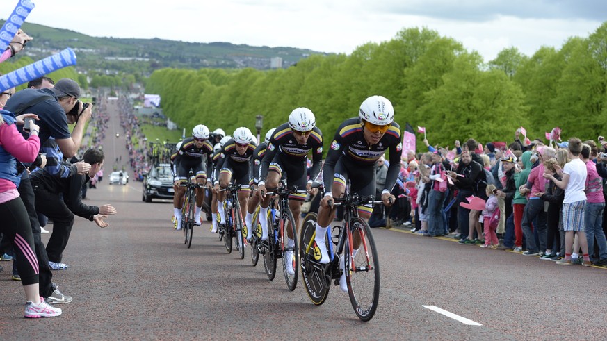 The Colombia team pedals during the first stage of the Giro d&#039;Italia, Tour of Italy cycling race, in Belfast, Northern Ireland, Friday May 9, 2014. Canadian Svein Tuft powered Orica Green-Edge to ...
