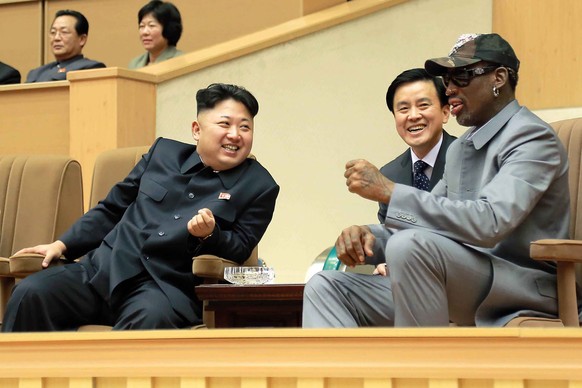 FILE - In this Jan. 8, 2014, photo provided by the North Korean government, North Korean leader Kim Jong Un, left, talks with former NBA player Dennis Rodman, right, as they watch an exhibition basket ...
