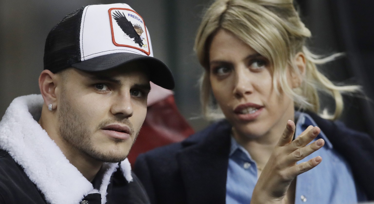 Inter Milan&#039;s Mauro Icardi is flanked by his wife Wanda Nara during the Europa League, round of 32, second leg soccer match between Inter Milan and SK Rapid Vienna, at the San Siro stadium in Mil ...