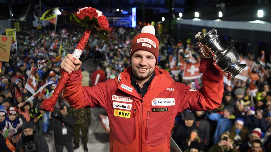 The winner Beat Feuz of Switzerland, celebrates during the prize giving ceremony after the men&#039;s downhill race at the Alpine Skiing FIS Ski World Cup in Wengen, Switzerland, Saturday, January 18, ...