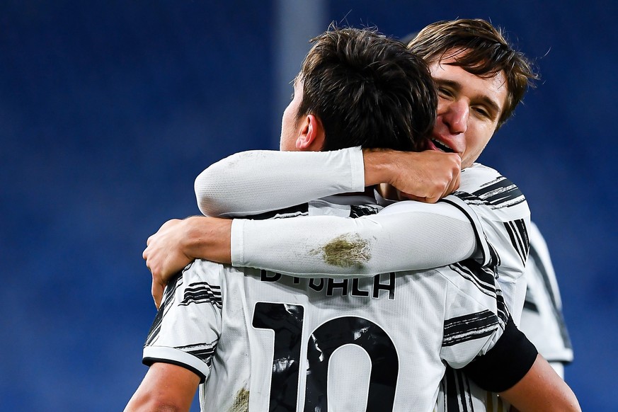 epa08882391 Juventus��� Paulo Dybala (front) celebrates with teammate Federico Chiesa after scoring his team&#039;s first goal during the Italian Serie A soccer match Genoa CFC vs Juventus FC at Luigi ...
