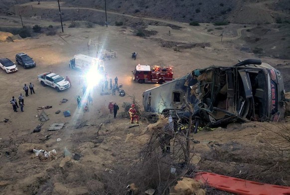 epa08764008 YEARENDER 2020 ..DISASTERS AND ACCIDENTS....People work at the site of a bus accident in Piura, near the border with Ecuador, Peru, 15 February 2020. At least eight people died and 30 were ...