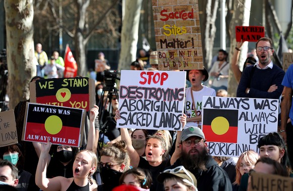 epaselect epa08474504 Protesters are seen during a rally outside the Rio Tinto office in Perth, Australia, 09 June 2020. Rio Tinto recently detonated explosives in an area of the Juukan Gorge in the P ...