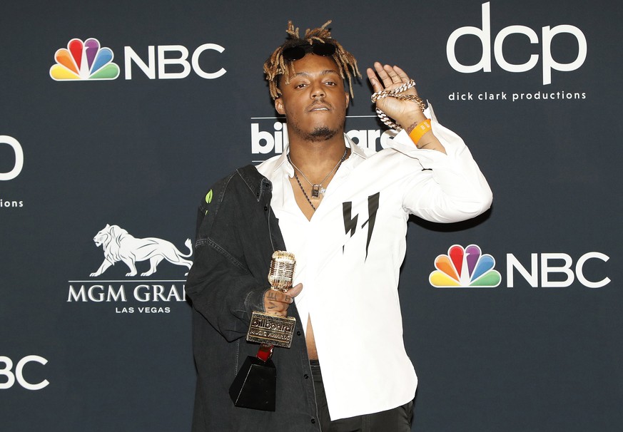 epa08056064 (FILE) - Juice WRLD poses with the Top New Artist Award in the press room at the 2019 Billboard Music Awards at the MGM Grand Garden Arena in Las Vegas, Nevada, USA, 01 May 2019 (reissued  ...