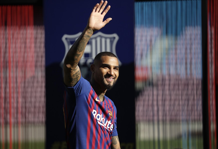 FC Barcelona new signing Kevin-Prince Boateng waves during his presentation at the Camp Nou stadium in Barcelona, Spain, Tuesday, Jan. 22, 2019. Barcelona surprisingly signed Kevin-Prince Boateng on l ...