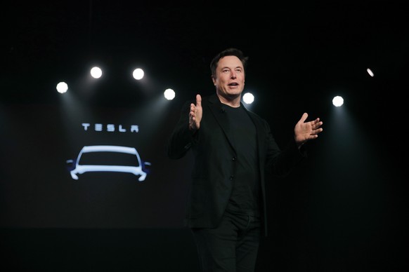 FILE- In this March 14, 2019, file photo Tesla CEO Elon Musk speaks before unveiling the Model Y at Tesla&#039;s design studio in Hawthorne, Calif. Tesla CEO Elon Musk says the electric car pioneer pl ...