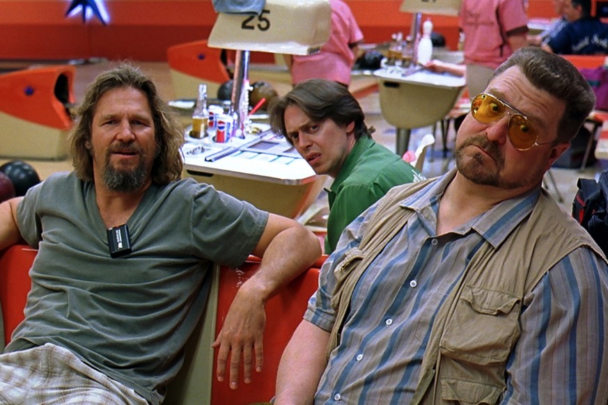 This handout photo provided by Universal Studios and the Library of Congress shows Jeff Bridges as “The Dude,” left, hanging out at the bowling alley with his buddies Walter (John Goodman) and Donny ( ...