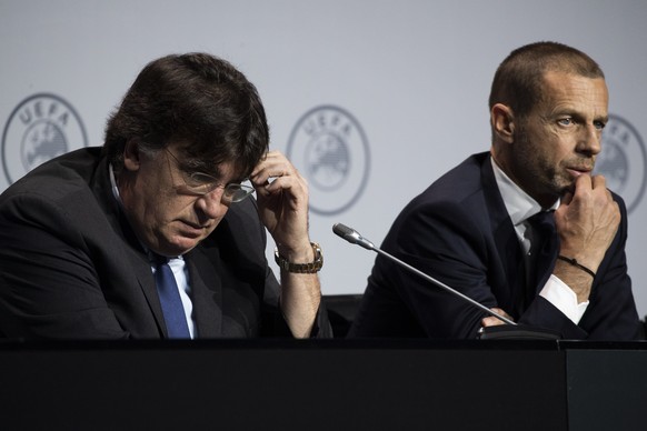 UEFA&#039;s Interim General Secretary Theodore Theodoridis, left, and President Aleksander Ceferin, right, answer questions on the virus outbreak following a meeting of European soccer leaders at the  ...