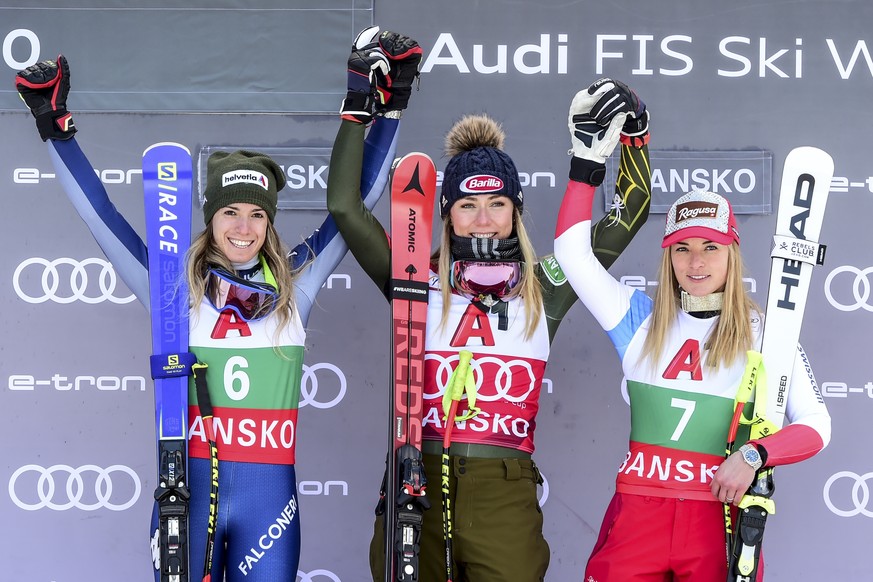 United States&#039; Mikaela Shiffrin, center, winner of an alpine ski, women&#039;s World Cup super-G, poses on the podium with second placed Italy&#039;s Marta Bassino, left, and third placed Switzer ...