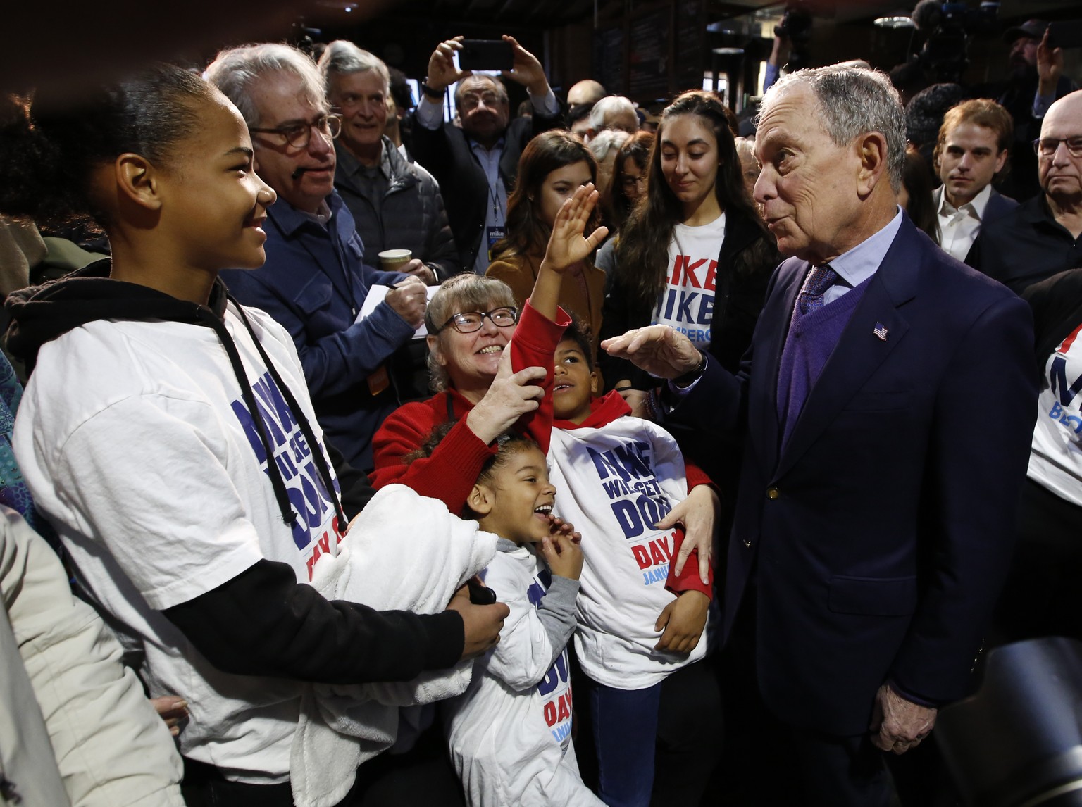 Democratic presidential candidate and former New York City Mayor Michael Bloomberg, right, talks with supporters during a campaign stop in Sacramento, Calif., Monday, Feb. 3, 2020. (AP Photo/Rich Pedr ...