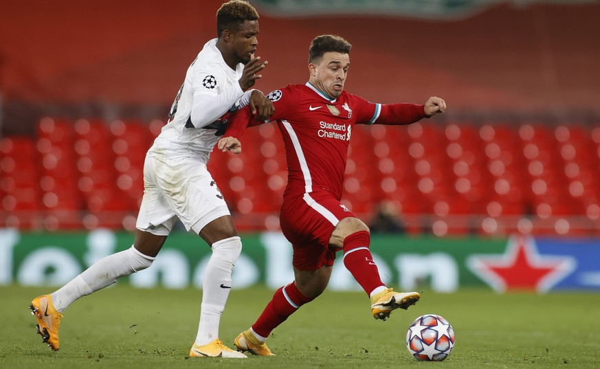 epa08779081 Liverpool&#039;s Xherdan Shaqiri (R) in action against Midtjylland&#039;s Frank Onyeka during the UEFA Champions League group D match between Liverpool FC and Midtjylland in Liverpool, Bri ...