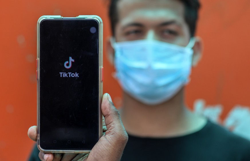 epa08538304 The Chinese video-sharing app TikTok on a smartphone, in Mumbai, India, 10 July 2020. India&#039;s national government in New Delhi has announced it is banning 59 Chinese phone application ...