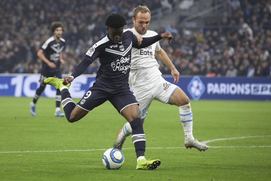 Marseille&#039;s Valere Germain challenges Bordeaux&#039;s Aurelien Tchouameni for the ball during the French League One soccer match between Marseille and Bordeaux at the Velodrome stadium in Marseil ...