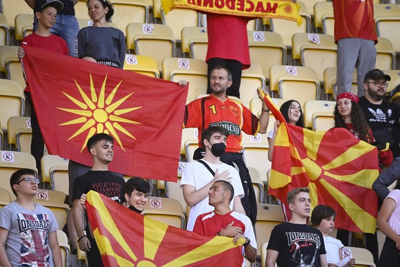 epa09247889 Fans of North Macedonia wave national flags during before the international friendly soccer match between North Macedonia and Kazakhstan in Skopje, Republic of North Macedonia, 04 June 202 ...